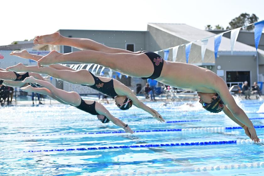 Torrey Pines swimmers dive in at a recent meet.