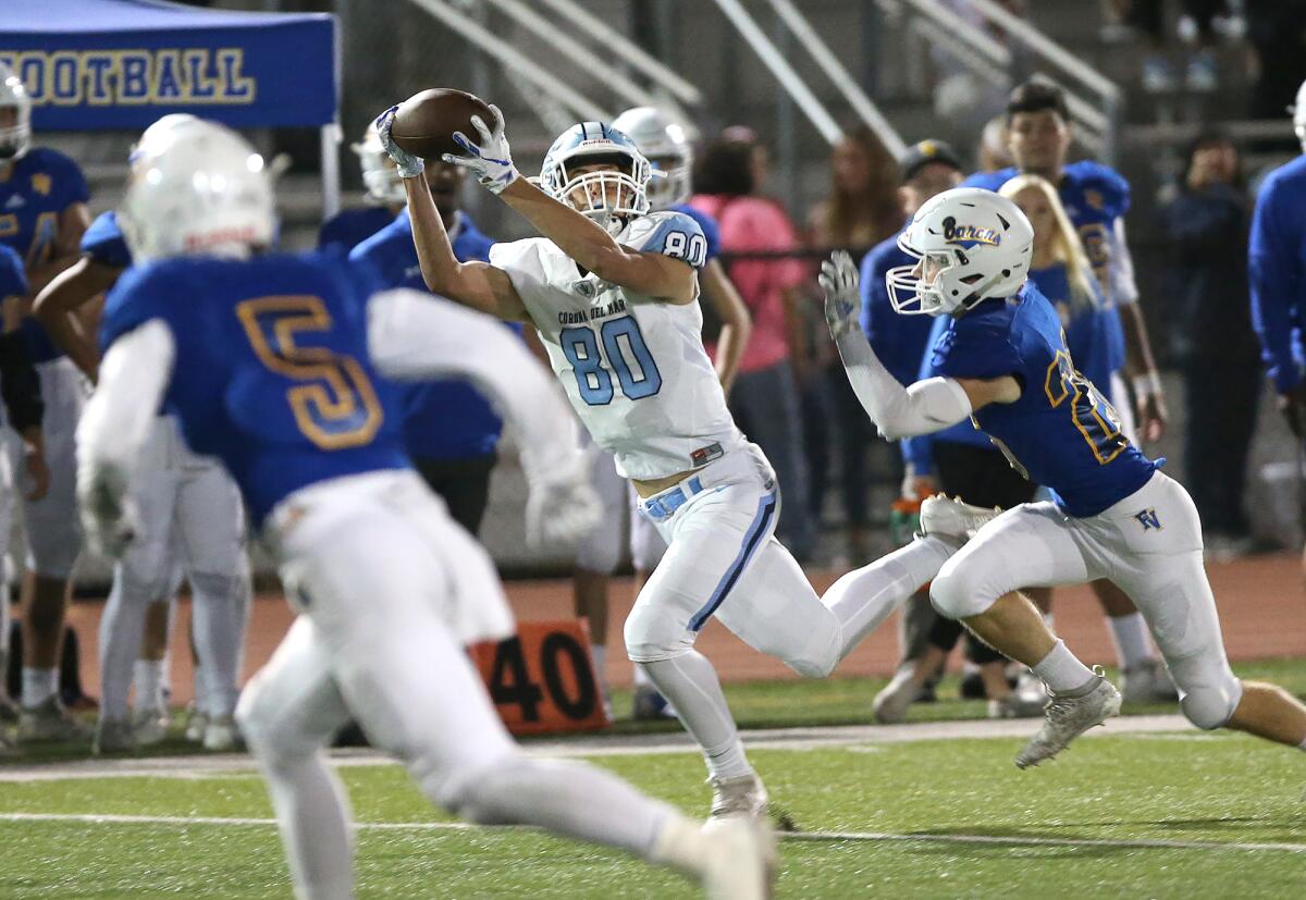 Corona del Mar tight end Scott Giuliano makes a 19-yard catch on the run in a Sunset League game against Fountain Valley on Thursday at Huntington Beach High.