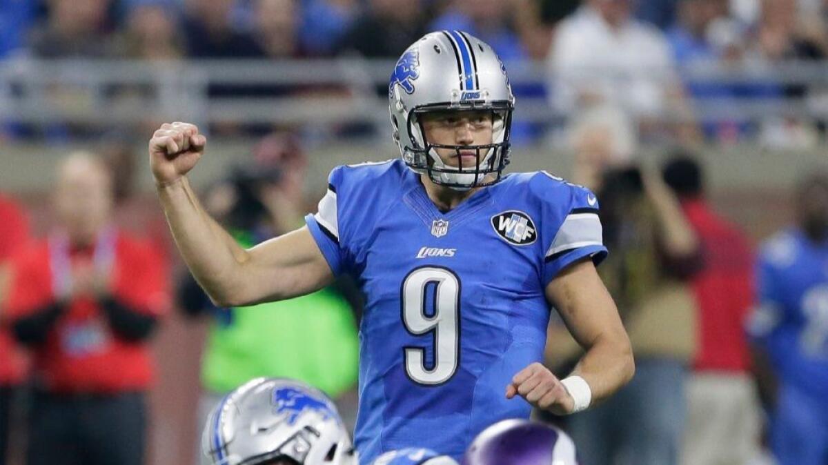 Lions quarterback Matthew Stafford gestures during a game against the Vikings on Thanksgiving Day on Nov. 24.