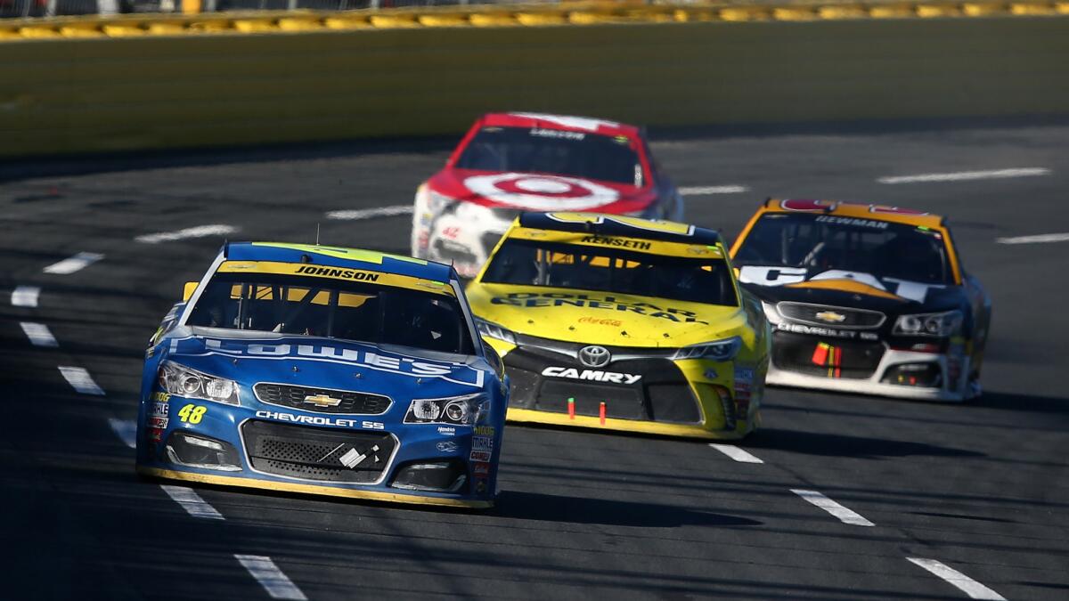 NASCAR driver Jimmie Johnson leads the field during the Sprint Cup race at Concord, N.C.