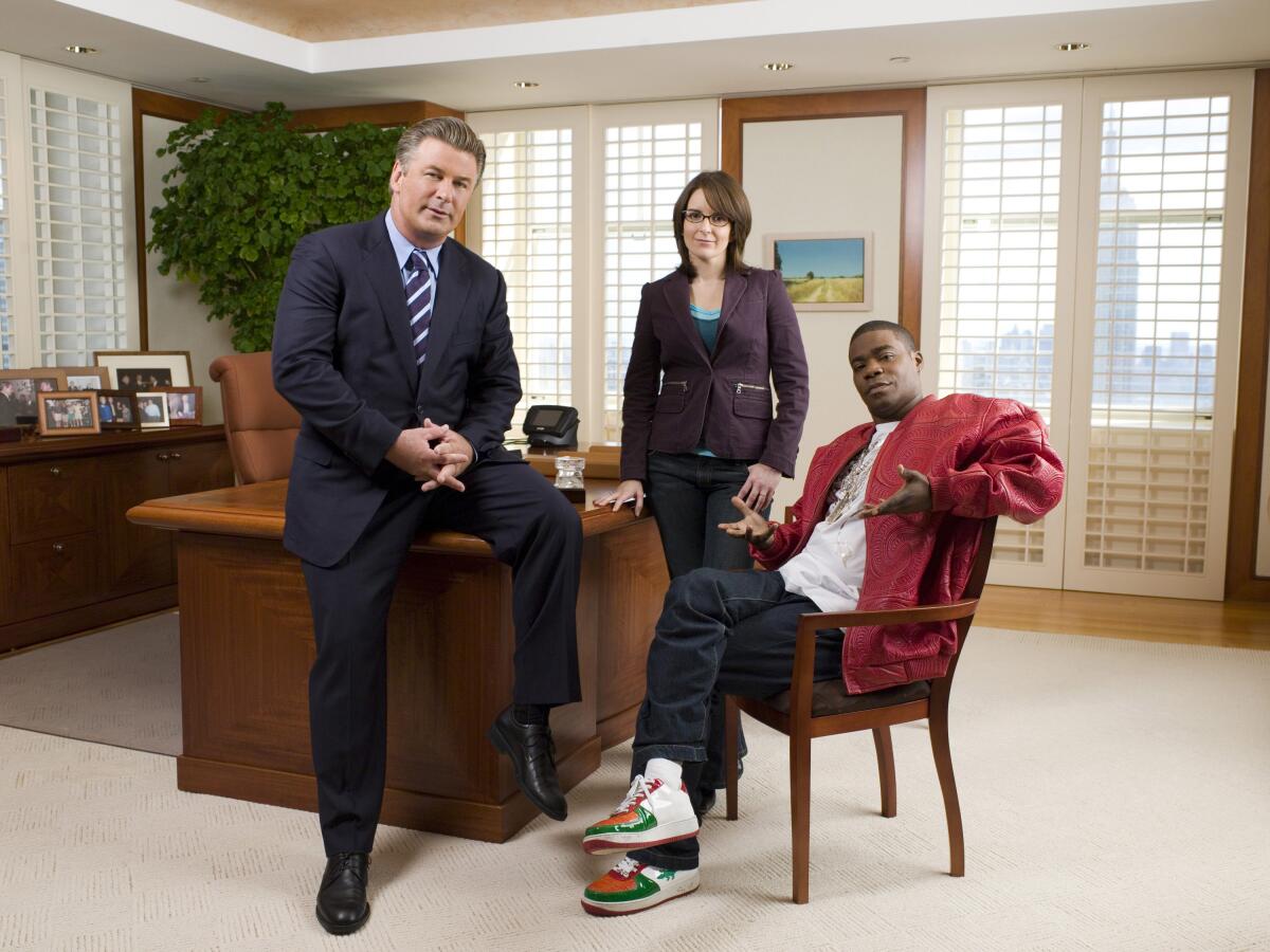 Alec Baldwin, left, Tina Fey and Tracy Morgan in "30 Rock.”