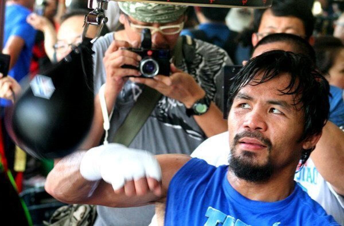 Manny Pacquiao hits the speed bag during a training session General Santos City last month.