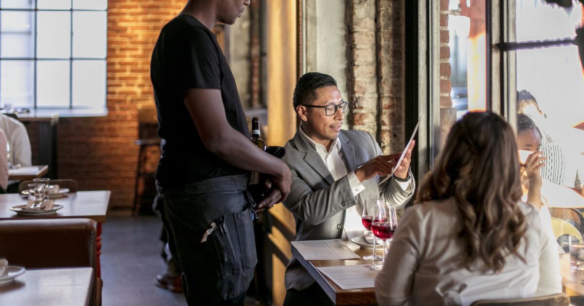 A last-minute reversal could allow California restaurants to keep service charges