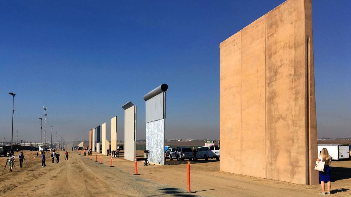 Prototypes of President Trump's proposed U.S.-Mexico border wall stand in San Diego in October 2017.