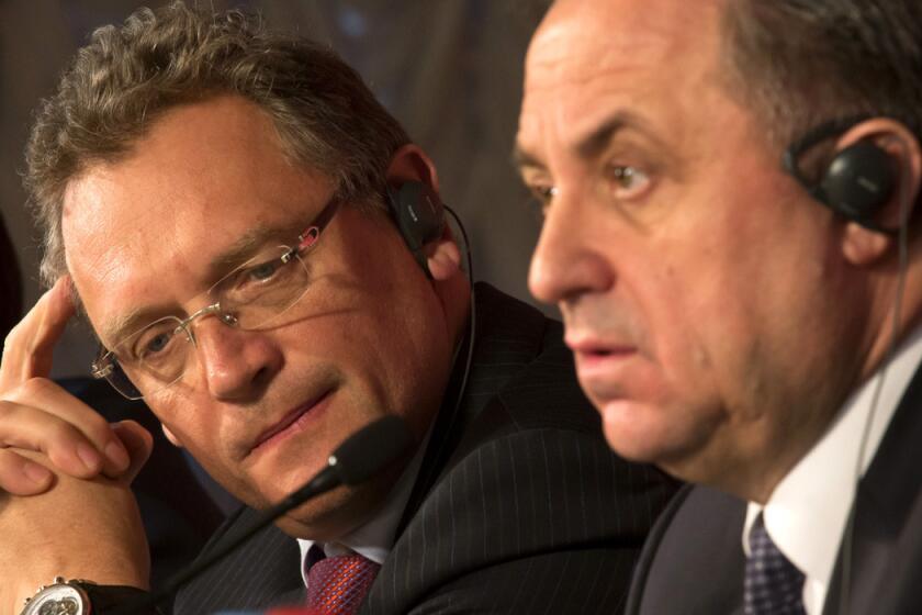 FIFA Secretary General Jerome Valcke, left, and Russian Sports Minister Vitaly Mutko attend a news conference in St. Petersburg, Russia on Feb. 16. The New York Times reported on Monday that the high-ranking FIFA official who allegedly made a $10-million payment central to a U.S. probe into soccer corruption is believed to be Sepp Blatter's right-hand man, Valcke.