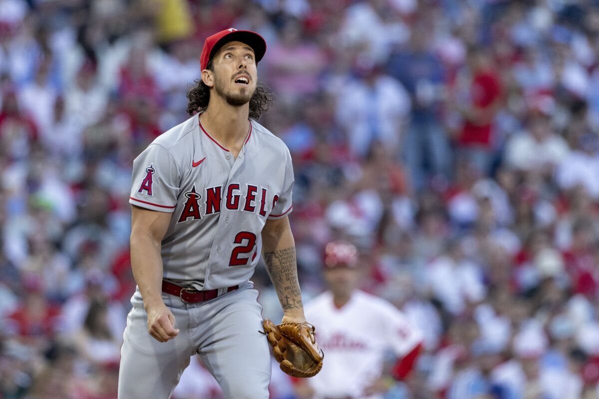 Angels starting pitcher Michael Lorenzen tracks a fly ball during the first inning June 4, 2022.