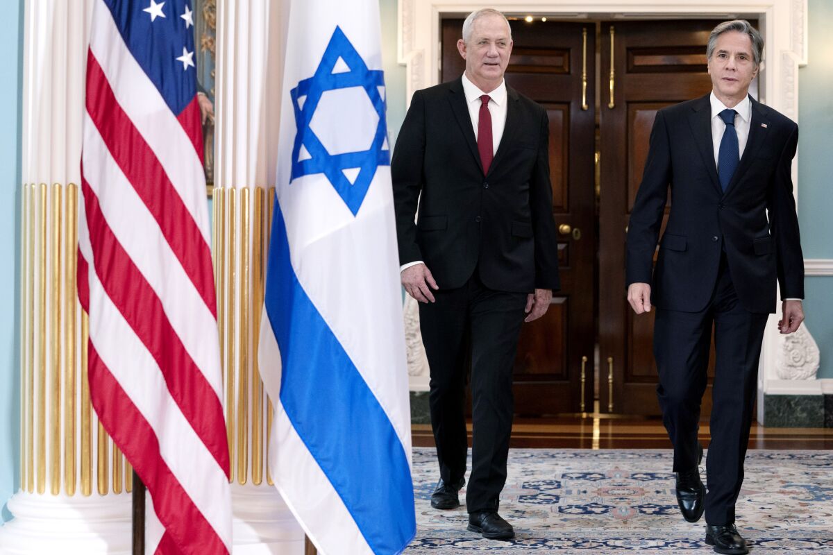 Secretary of State Antony Blinken, right, walks with Israel's Defense Minister Benny Gantz, Thursday, June 3, 2021, at the State Department in Washington. (AP Photo/Jacquelyn Martin)