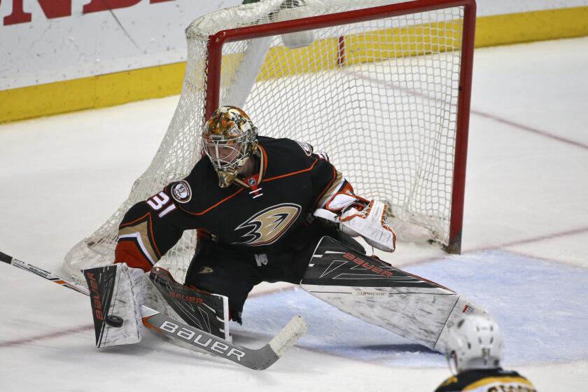 Ducks goalie Frederik Andersen blocks a Boston Bruins' shot on March 18.