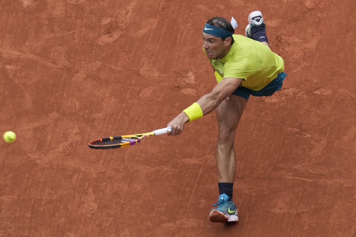 Rafael Nadal reaches for the ball at the French Open.