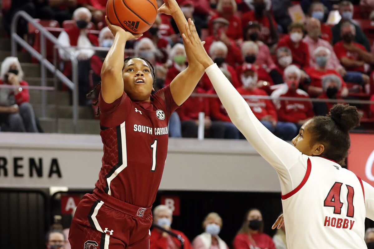 South Carolina's Zia Cooke (1) shoots over North Carolina State's Camille Hobby (41) during the first half of an NCAA college basketball game, Tuesday, Nov. 9, 2021 in Raleigh, N.C. (AP Photo/Karl B. DeBlaker)