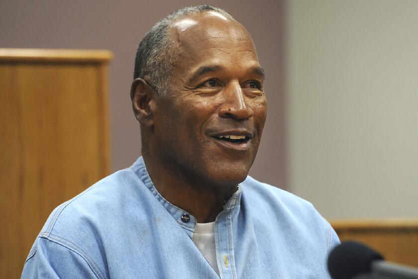 FILE - Former NFL football star O.J. Simpson appears via video for his parole hearing at the Lovelock Correctional Center in Lovelock, Nev., on July 20, 2017. Simpson, the decorated football superstar and Hollywood actor who was acquitted of charges he killed his former wife and her friend but later found liable in a separate civil trial, has died. He was 76. (Jason Bean/The Reno Gazette-Journal via AP, Pool, File)