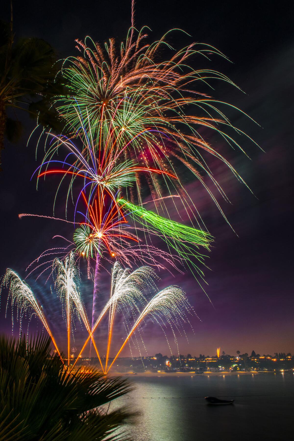 Fireworks light up the sky on Independence Day on the Back Bay at Newport Dunes Waterfront Resort.