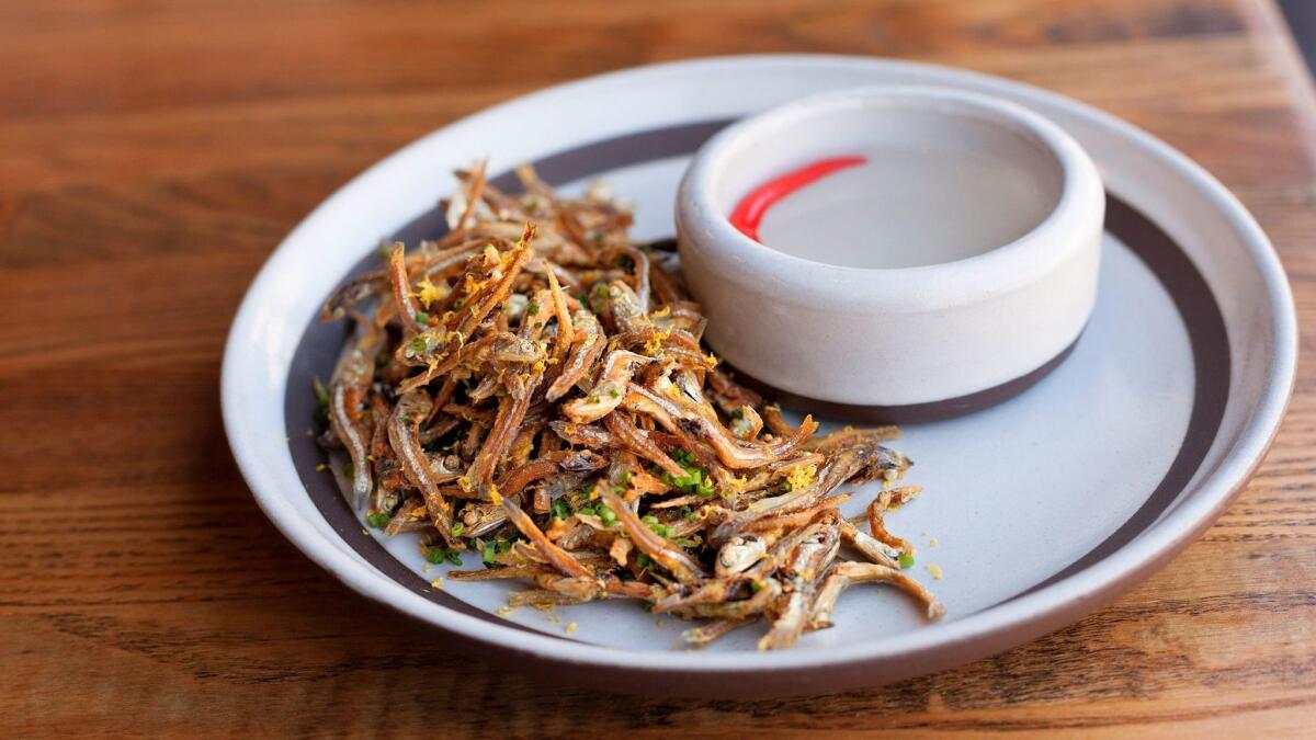 Dried and fried anchovies are a beloved Filipino snack, served exquisitely at Irenia with a pungent infused vinegar for dipping. (Meg Strouse)