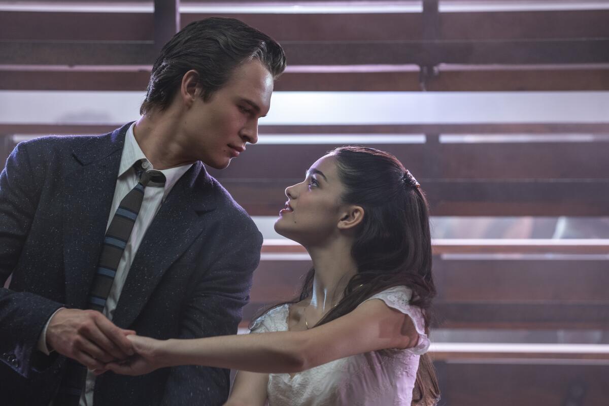 Ansel Elgort looks down at Rachel Zegler in a scene from "West Side Story."