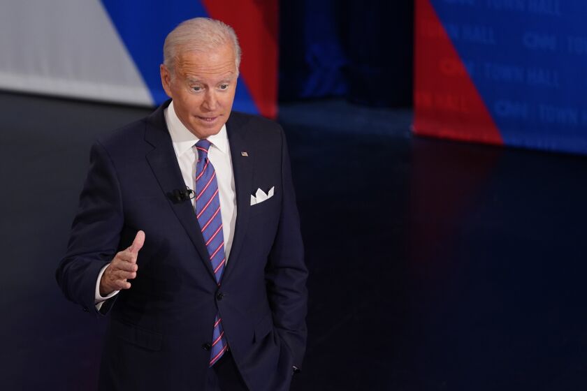 President Joe Biden participates in a CNN town hall at the Baltimore Center Stage Pearlstone Theater, Thursday, Oct. 21, 2021, in Baltimore, with moderator Anderson Cooper. China on Friday, Oct. 22, said there is “no room” for compromise or concessions over the issue of Taiwan, following a comment by U.S. President Biden that the U.S. is committed to defending the island if it is attacked. (AP Photo/Evan Vucci)