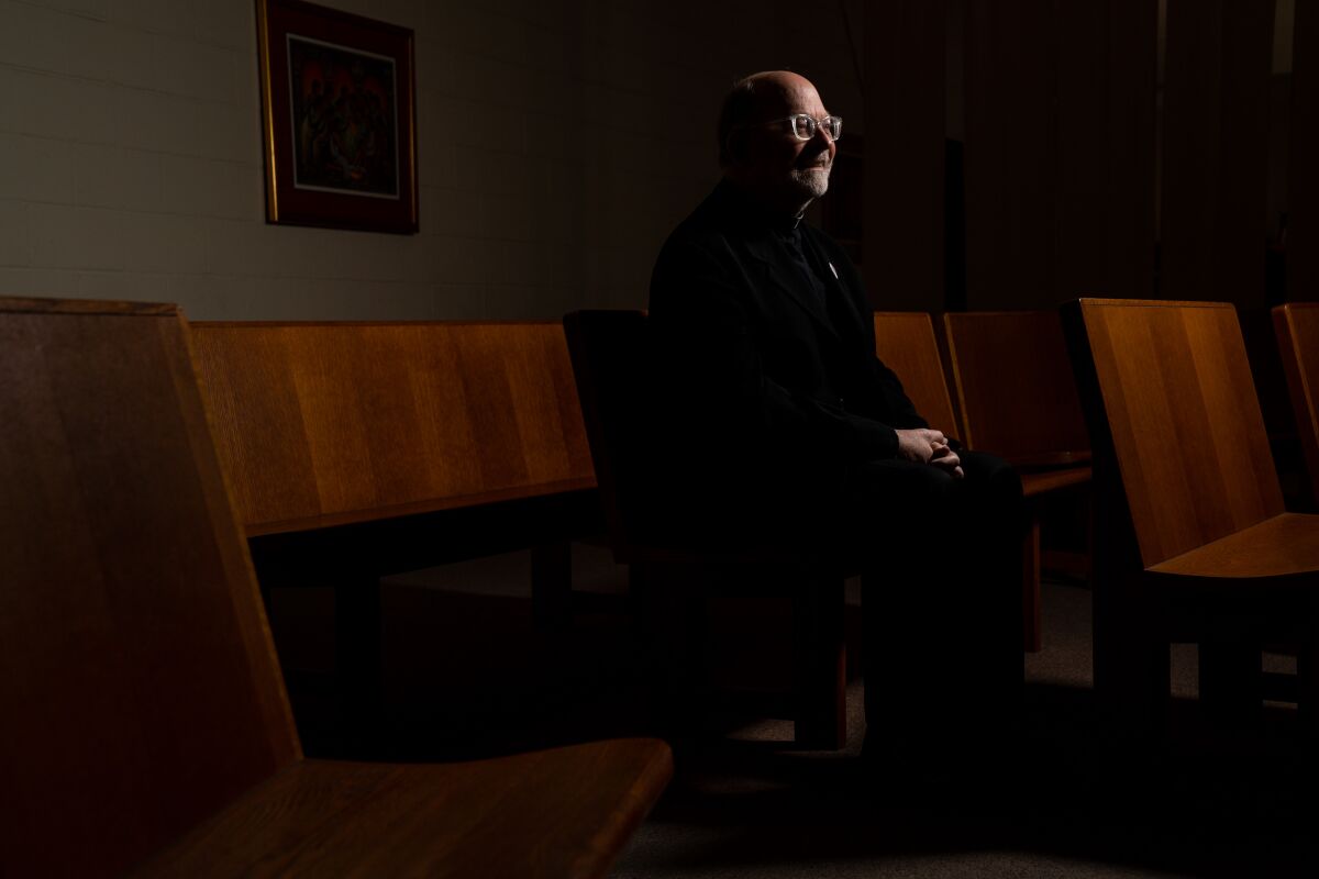 During the coronavirus pandemic, priests such as Father Chris Ponnet of the St. Camillus Catholic Center for Pastoral Care in Los Angeles are continuing to work in hospitals as chaplains or volunteers who administer sacraments to patients.