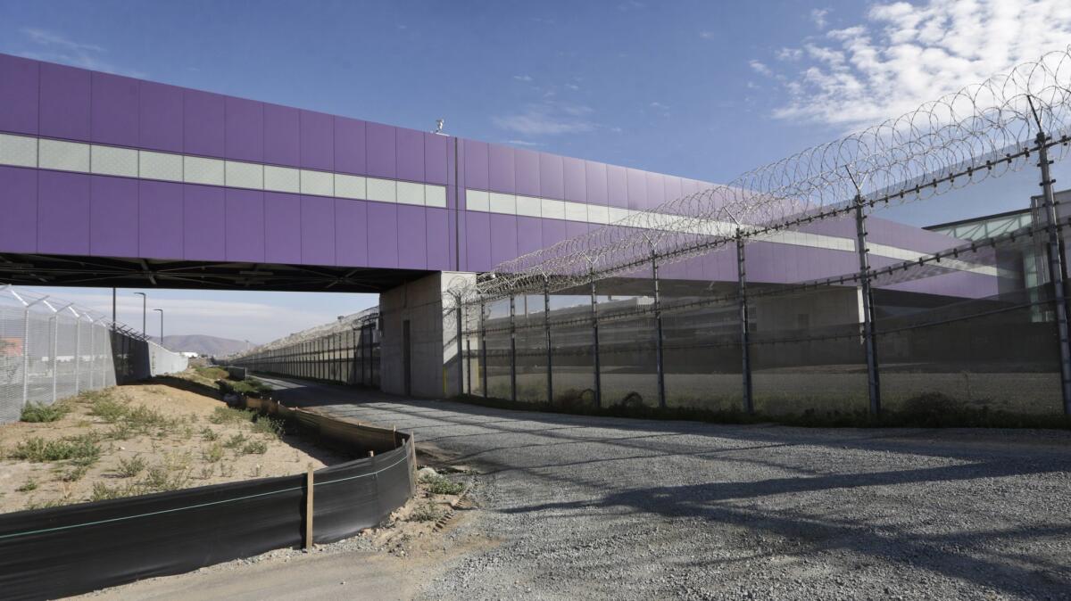 The Cross Border Xpress, which opened Wednesday, allows people to walk across the U.S.- Mexico border directly into Tijuana International Airport.