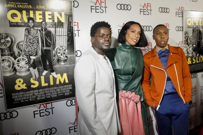 HOLLYWOOD, CA --NOVEMBER 14, 2019—Actor Daniel Kaluuya, director Melina Matsoukas and Writer and producer Lena Waithe, from left, on the red carpet, opening night, at the ”Queen & Slim" premiere, during AFI FEST 2019, at the TCL Chinese Theatre, in Hollywood, CA, Nov 14, 2019. (Jay L. Clendenin / Los Angeles Times)
