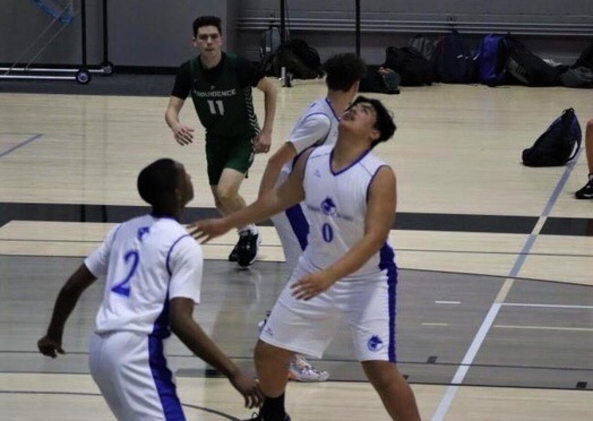 Taka Mahe of Wisburn-Da Vinci gets into position for a rebound.