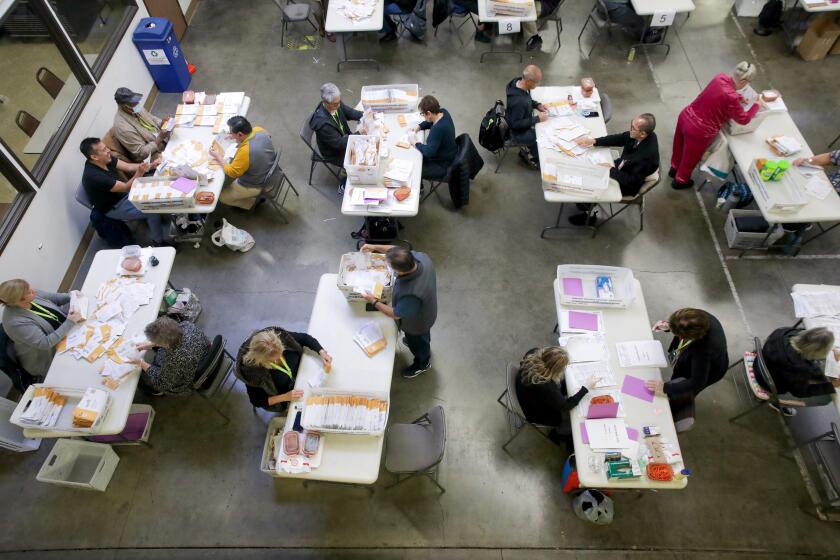 Santa Ana, CA - November 09: Vote-By-Mail ballot processing in progress at Orange County Registrar of Voters on Wednesday, Nov. 9, 2022 in Santa Ana, CA. (Irfan Khan / Los Angeles Times)
