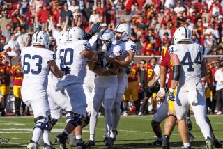 LOS ANGELES, CA - OCTOBER 12, 2024: Teammates swarm Penn State Nittany Lions.