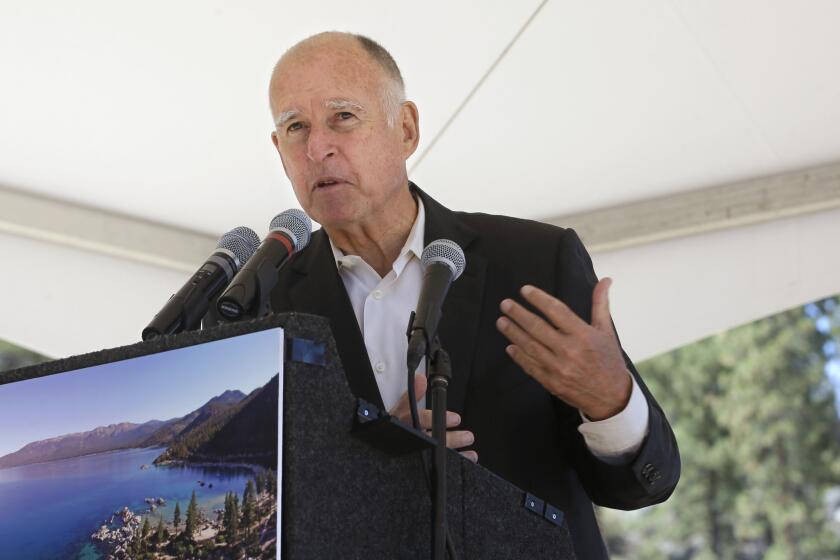 Gov. Jerry Brown speaks during a conference at Lake Tahoe, Nev., on Monday. He's been pushing legislation to reduce gasoline use, arousing oil industry opposition.
