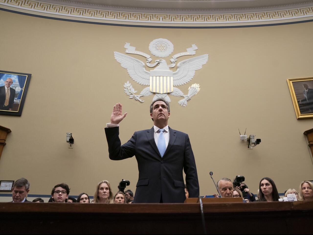 Michael Cohen, President Donald Trump's former personal lawyer, is sworn in to testify on Capitol Hill in Washington.