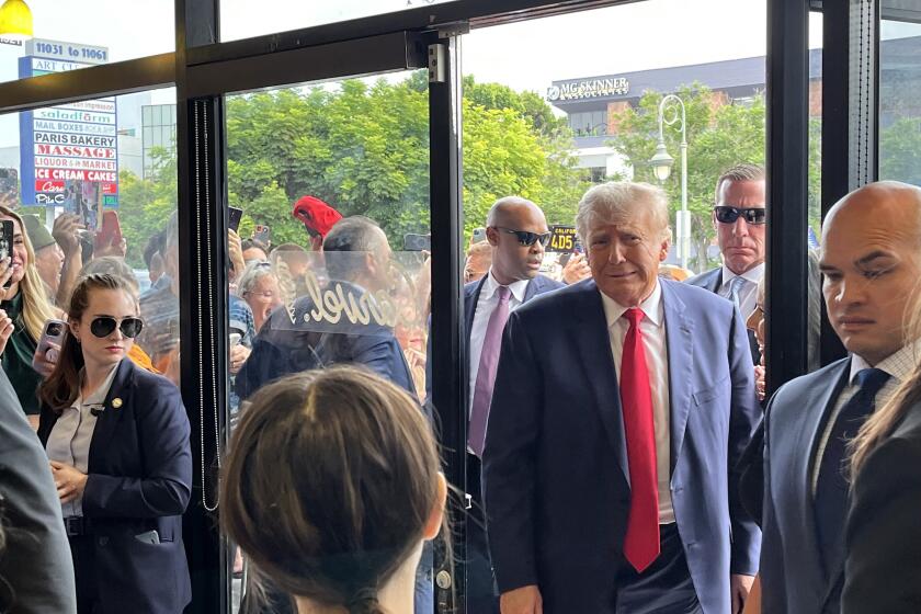 Former president Donald Trump greets supporters at Carvel Ice Cream in the Westwood neighborhood of Los Angeles on Friday, Sept. 29, 2023.