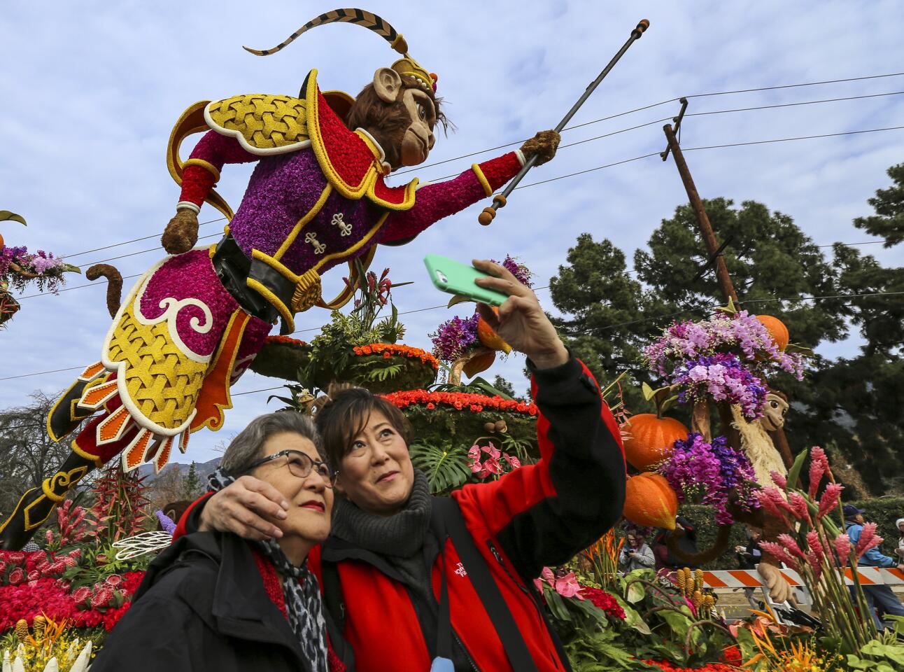 Natalie Nakatani, right, takes a selfie with her mother, Fujiko Nakatani, at the Showcase of Floats, where visitors were able to get an up-close view of Rose Parade floats Tuesday morning.