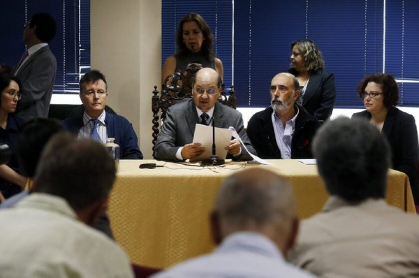 At a news conference in Santiago, Chile, Patricio Bustos, director of the Chilean Forensic Service, reports the results of tests on the exhumed remains of poet Pablo Neruda.