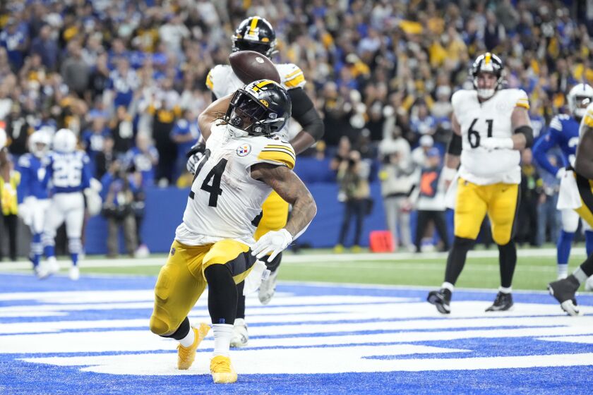 Pittsburgh Steelers running back Benny Snell Jr. (24) celebrates a touchdown run during the second half of an NFL football game against the Indianapolis Colts, Monday, Nov. 28, 2022, in Indianapolis. (AP Photo/AJ Mast)