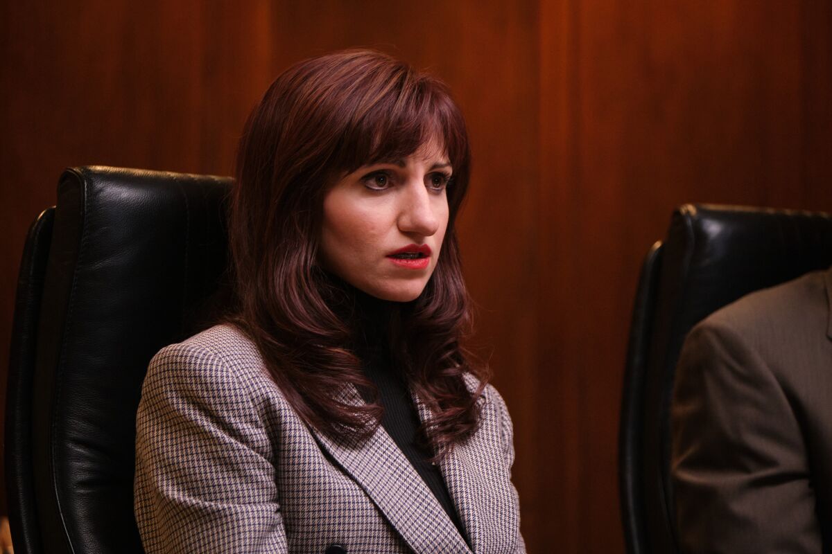 Annaleigh Ashford as Paula Jones post-makeover, with straight, non-teased hair.