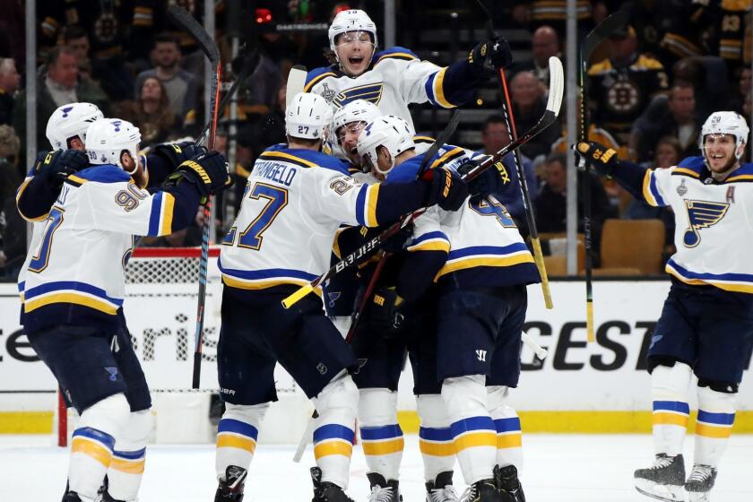 BOSTON, MASSACHUSETTS - MAY 29: Carl Gunnarsson #4 of the St. Louis Blues is congratulated by his teammates after scoring the game winning goal during the first overtime period against the Boston Bruins in Game Two of the 2019 NHL Stanley Cup Final at TD Garden on May 29, 2019 in Boston, Massachusetts. (Photo by Bruce Bennett/Getty Images) ** OUTS - ELSENT, FPG, CM - OUTS * NM, PH, VA if sourced by CT, LA or MoD **