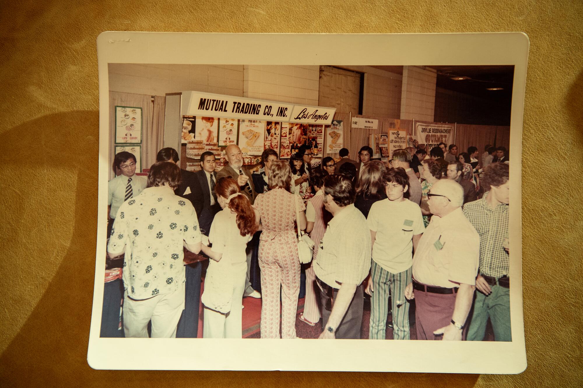 Harry Wolff Jr. appears at a trade show booth for Mutual Trading Co.