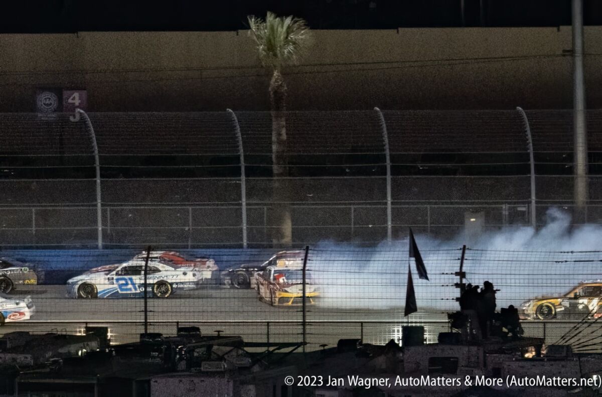 NASCAR Xfinity Series chaos far away on the back straight.