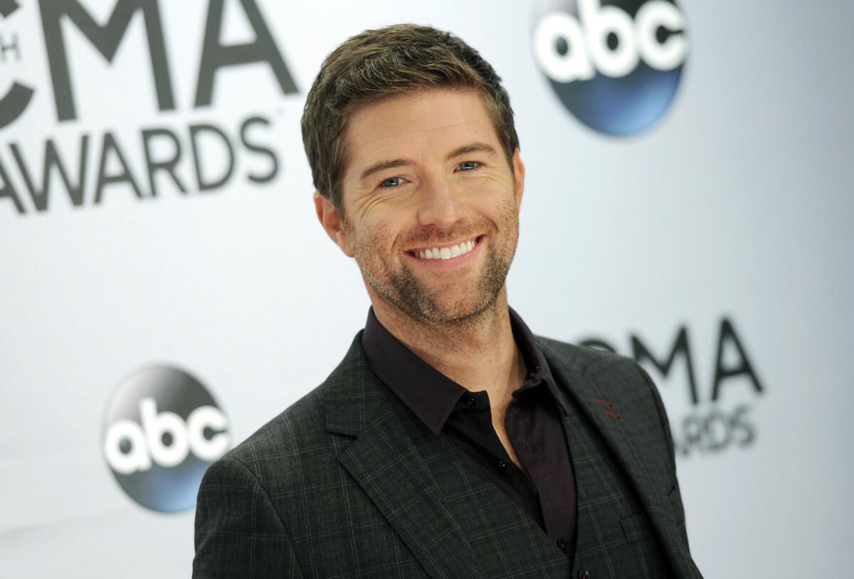 Josh Turner arrives at the CMA Awards in 2014. Authorities in central California say a bus crashed while carrying the road crew for the country and gospel singer.  Turner and his band were not on the bus. 