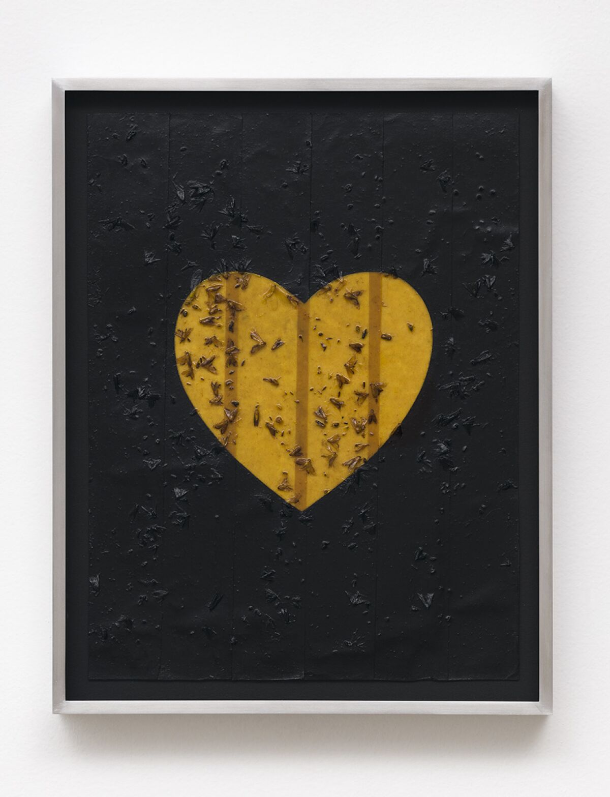 A painting in black shows a heart out in the middle made of fly paper covered in flies.