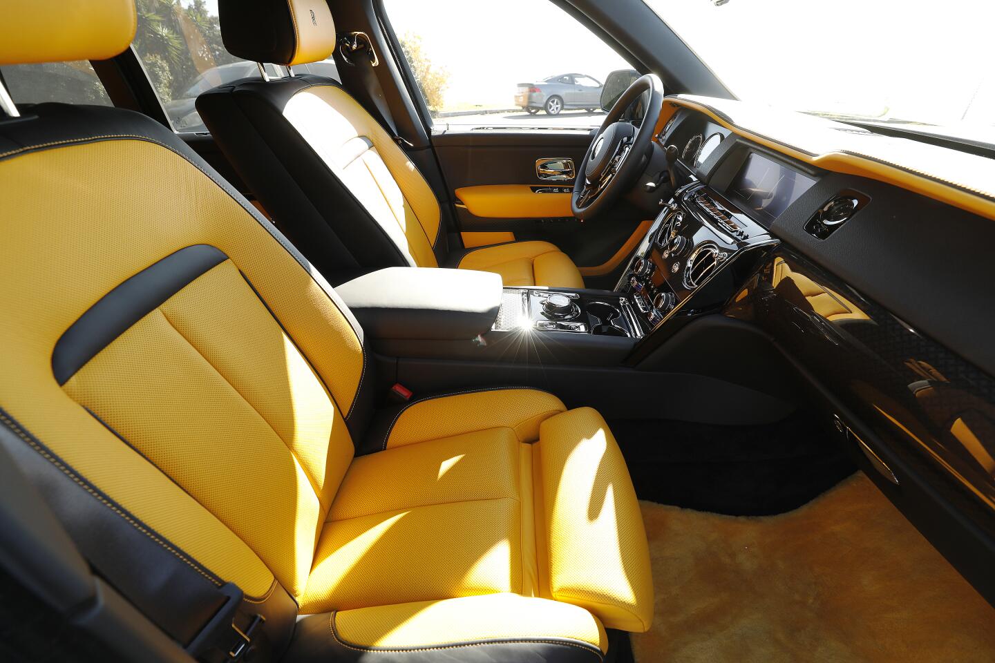 The black and yellow interior of the Rolls-Royce Cullinan.