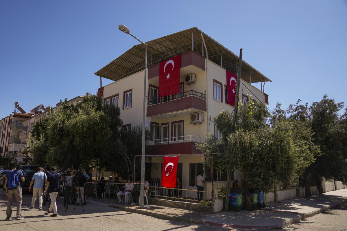 Media members and relatives gather outside the family house of Aysenur Ezgi Eygi in Didim, Turkey.