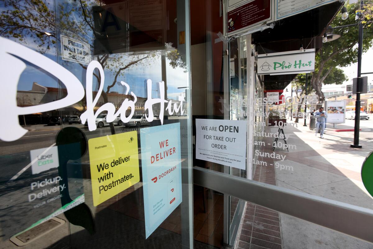 Restaurants like the Pho Hut on Brand Boulevard have switched to a to-go-only model after Los Angeles County health officials ordered restaurant dining rooms be shut down to help slow the spread of the novel coronavirus.