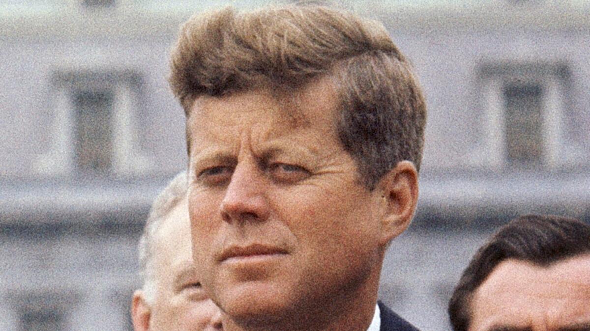 On April 30, 1963, President John F. Kennedy listens while Grand Duchess Charlotte of Luxembourg speaks outside the White House in Washington, D.C.