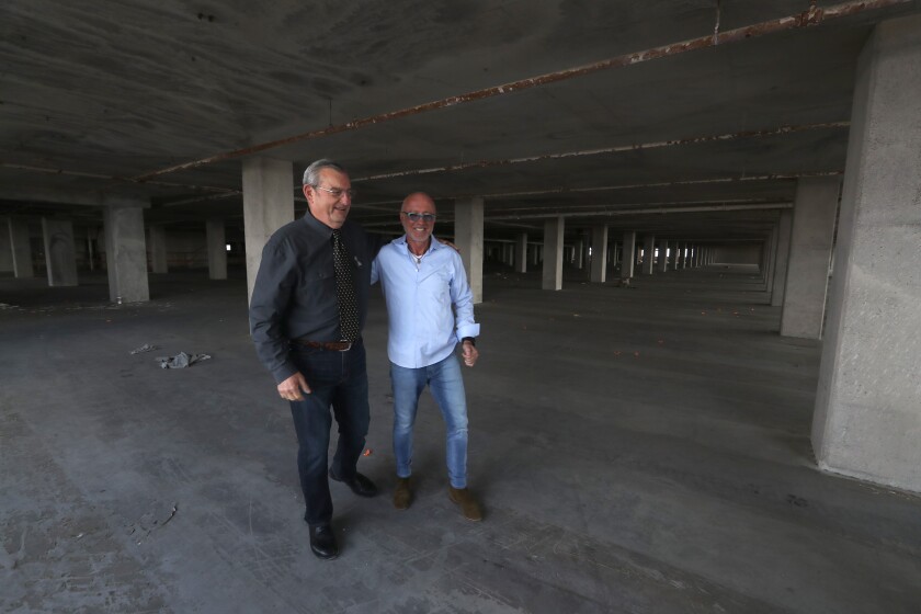 Businessmen Izek Shomof, right, owner of the Boyle Heights Sears Building, and William Taormina.