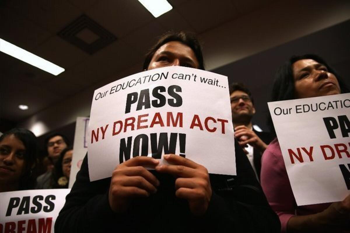 Demonstrators show support for the New York state DREAM Act at a rally in New York City.