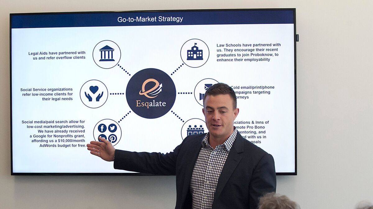 Chad Trainer of Santa Ana-based Esqalate pitches his idea to a judges panel during UC Irvine's third annual Designing Solutions for Poverty Competition.