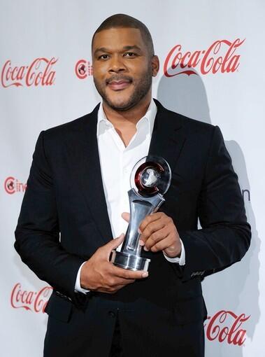 "For Colored Girls" director Tyler Perry received the Visionary Award at the theater owners' convention in Las Vegas.