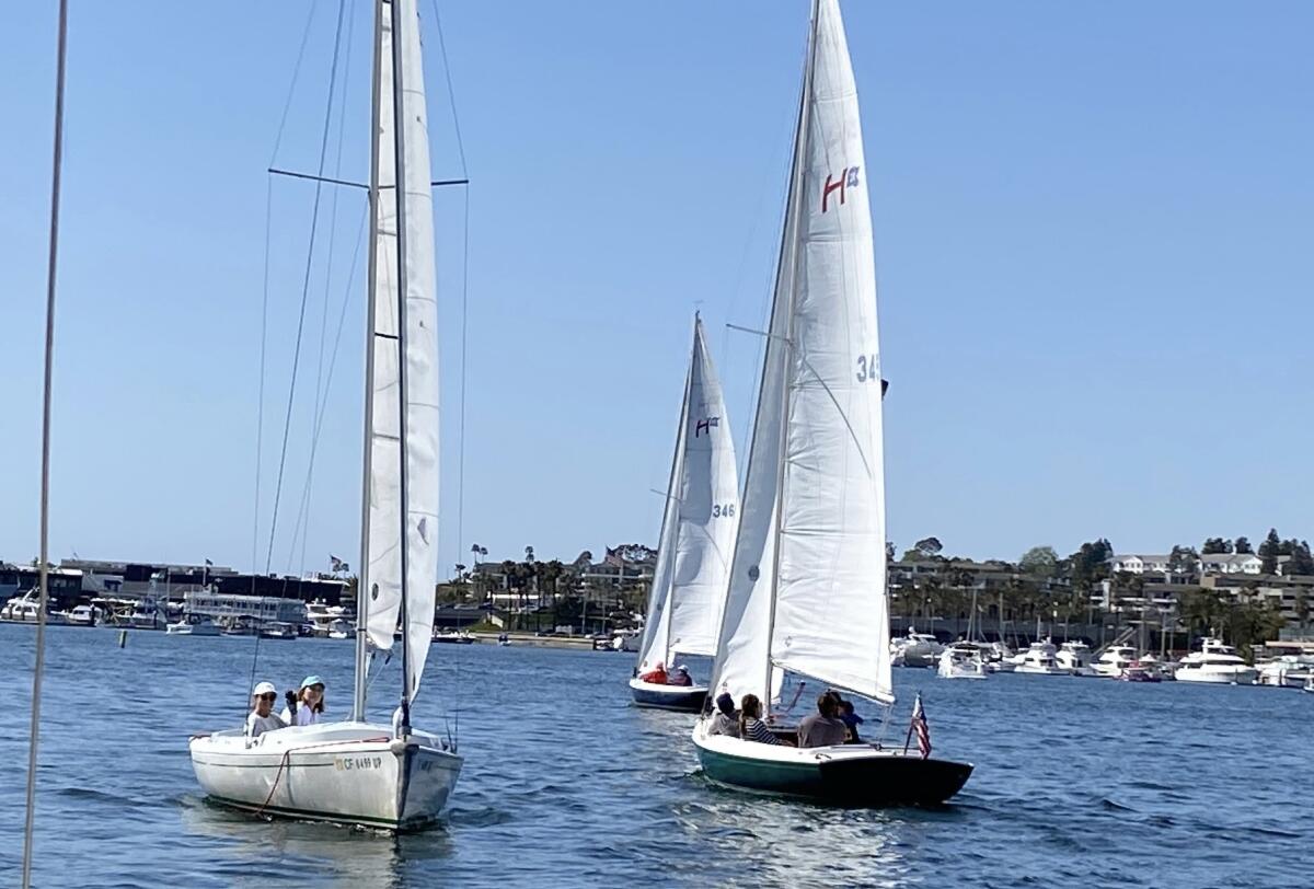 SkipHers participants sail Harbor-20 boats during Monday evening's class in Newport Harbor.