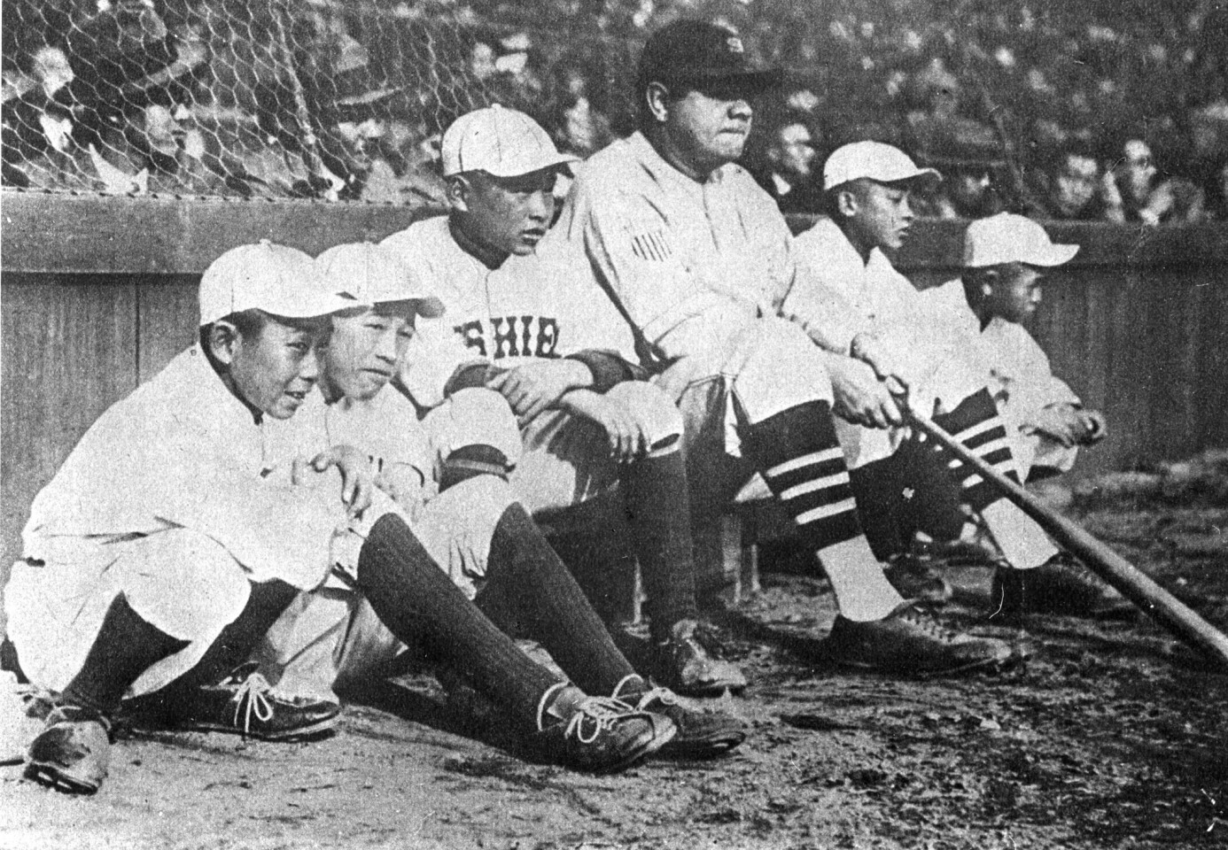 TOKYO - 1934. During the 1934 tour of Japan, Babe Ruth poses for a photo with young Japanese players. (Photo by Mark Rucker/Transcendental Graphics, Getty Images)