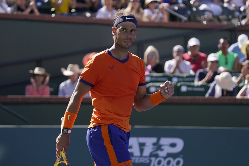 Rafael Nadal celebrates after defeating Daniel Evans at the BNP Paribas Open tournament.