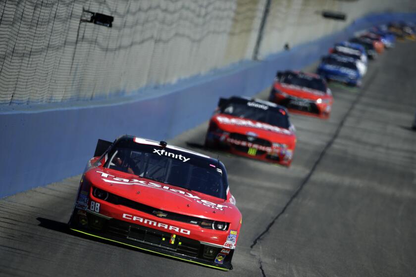 NASCAR driver Kevin Harvick leads the pack in the Xfinity Series Drive4Clots.com 300 at Auto Club Speedway on Saturday in Fontana.