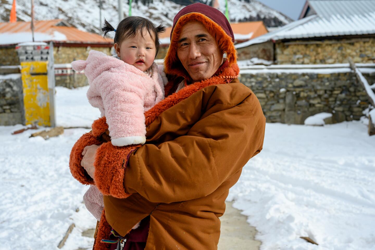 My Tibetan friend's uncle, a yak herder, holding his niece. He had returned to his home village in Garze for Losar, the Tibetan New Year, on Jan. 27, 2020.